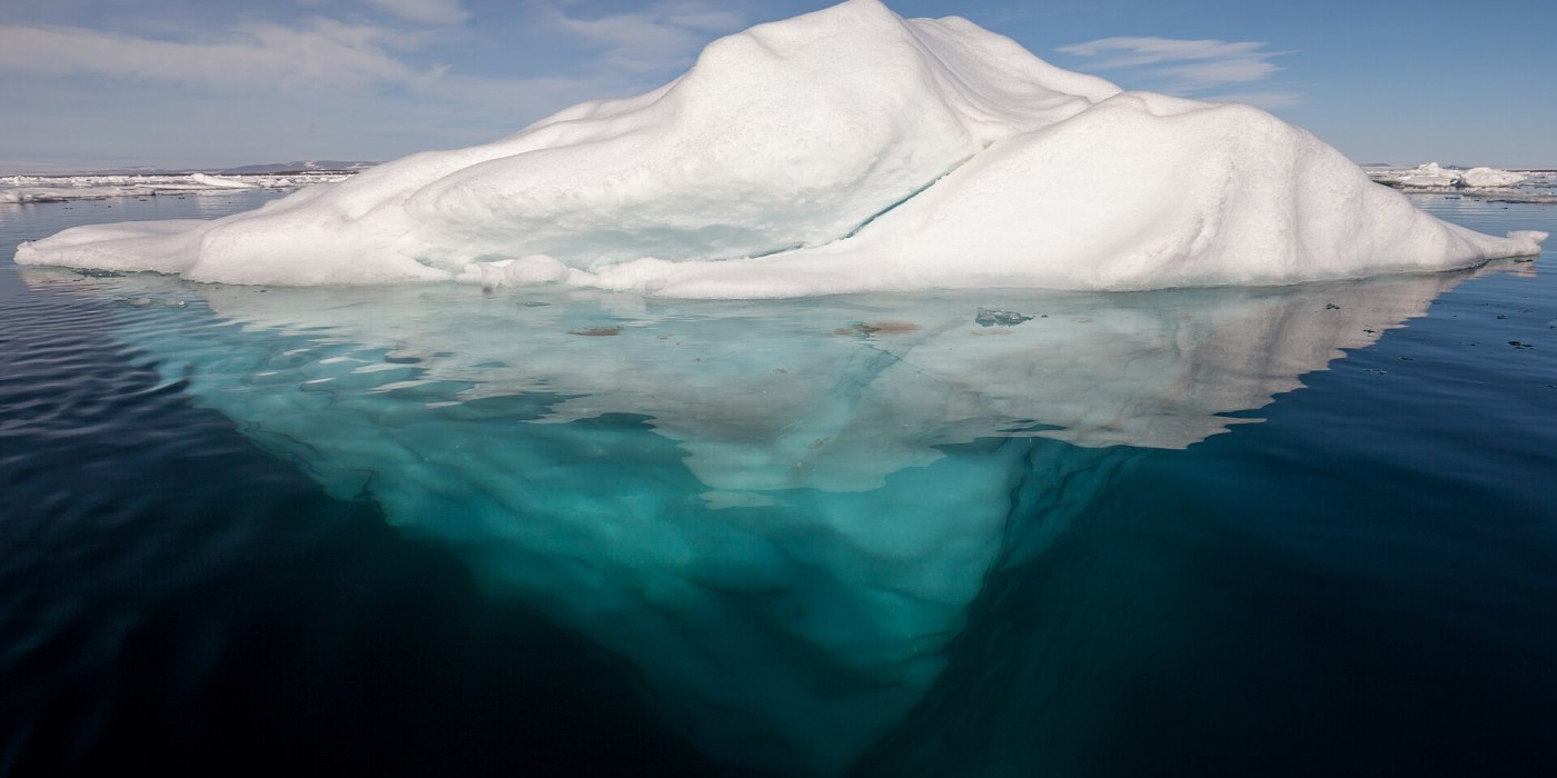 Iceberg_in_the_Arctic_with_its_underside_exposed Iceberg_in_the_Arctic_with_its_underside_exposed
